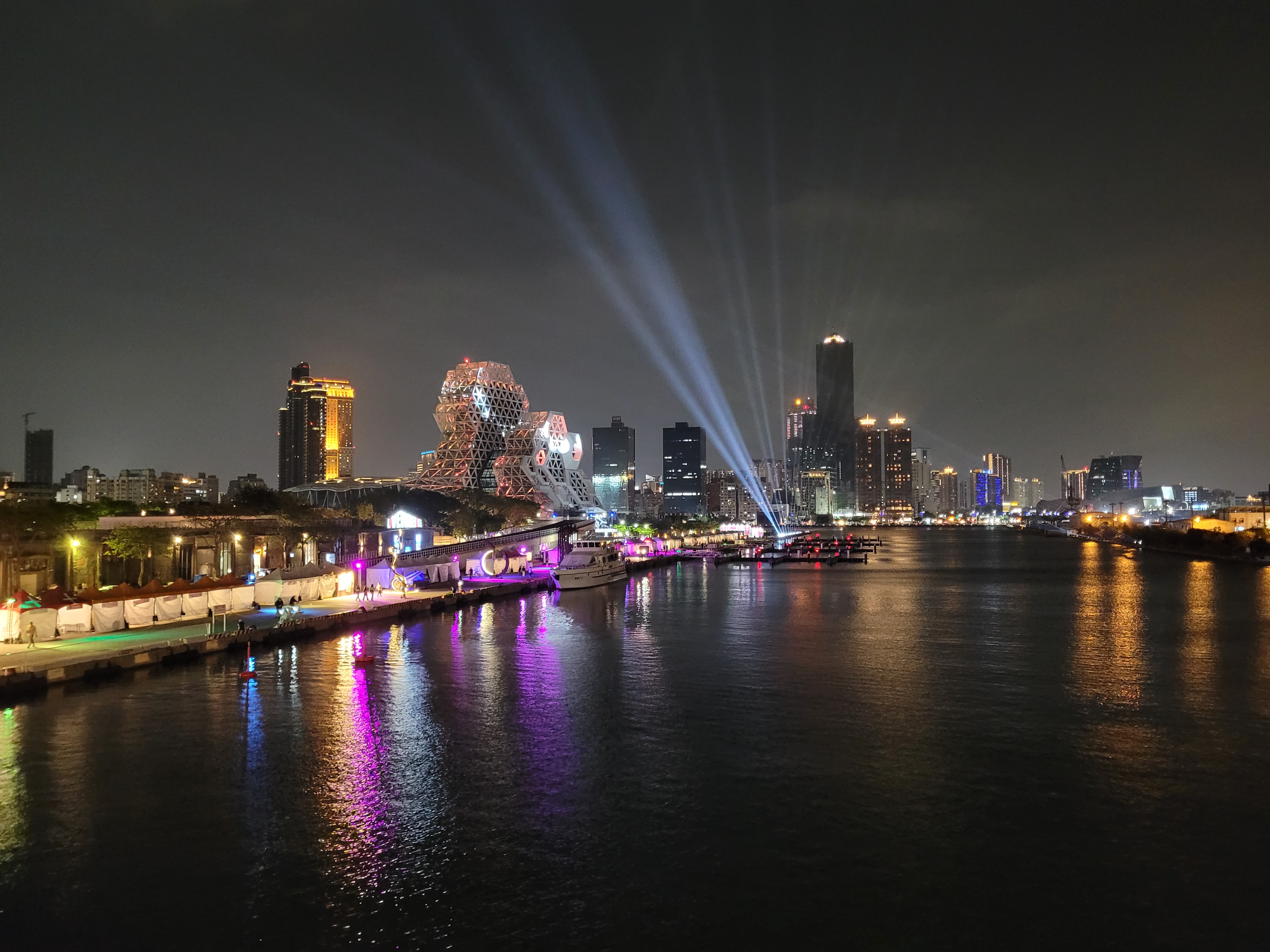 10/04/2025 - Kaohsiung night view -
					This picture was taken during the night in Kaohsiung on the Great Harbor Bridge.
					On the middle left, the Kaohsiung Music Center, a concert hall with a unique architecture.
					On the middle right, the 85 Sky Tower, the tallest building in Kaohsiung and second tallest of Taiwan.