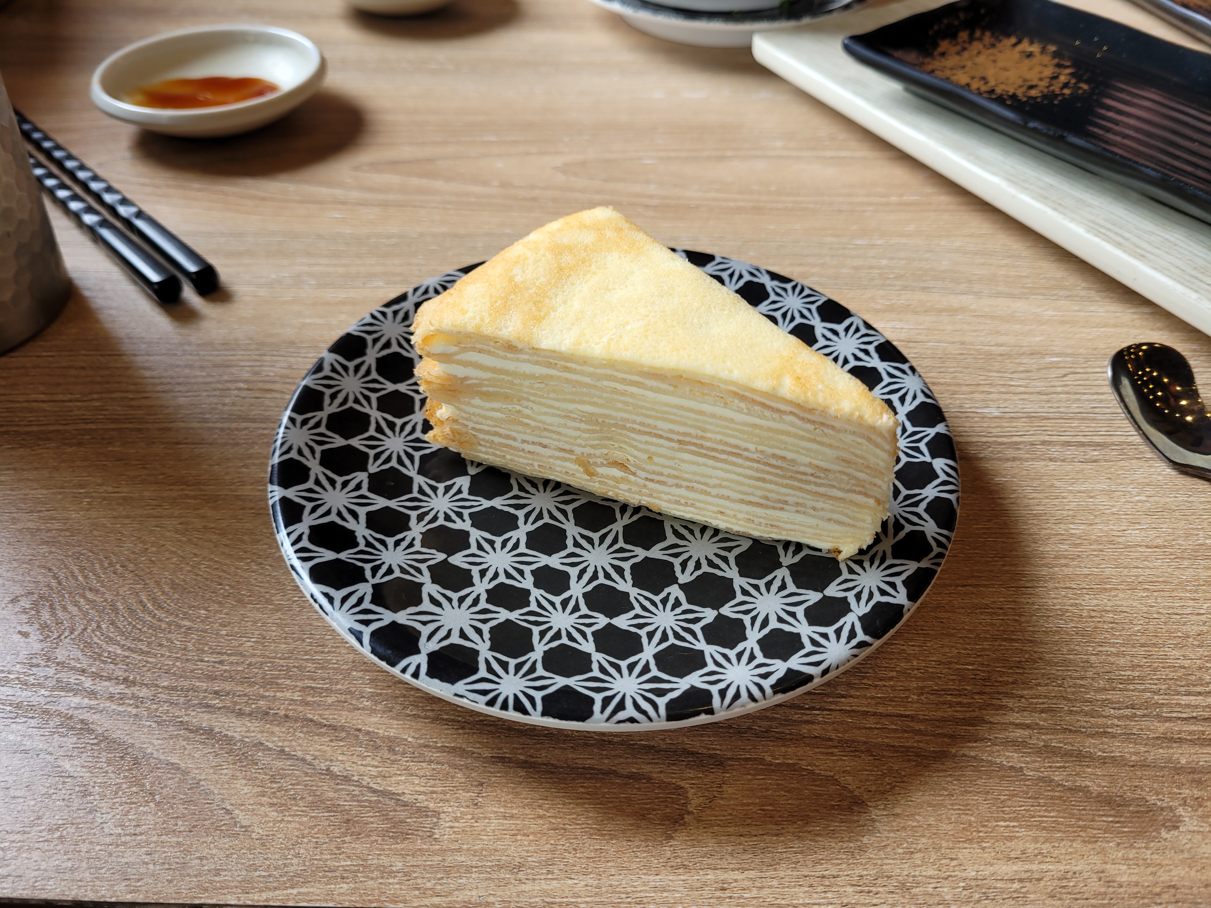 11/04/2025 - Mille crêpes -
						It is my birthday today so here is a cake!
						The Mille crêpes is made of layers of crêpes and cream and was invented by the Japanese pastry chef Emy Wada.
						While in France, she fell in love with crêpes, but being very thin they tend to dry out quickly.
						Emy discovered that stacking them in layers with a filling in between preserved their freshness.
						She called her creation “mille crêpes,” a mix between crêpes and mille-feuille.
						This cake is very popular in Taiwan and you can find different versions of it everywhere.